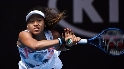 Naomi Osaka hits a return against China's Zheng Saisai on her way to a 6-2, 6-4 victory. AFP