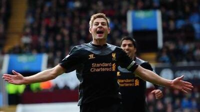 Steven Gerrard celebrates after scoring off a penalty for Liverpool's second goal to lift them over host Aston Villa.