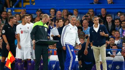 Jose Mourinho paces the touchline during Chelsea's preseason game against Fiorentina. Julian Finney / Getty Images
