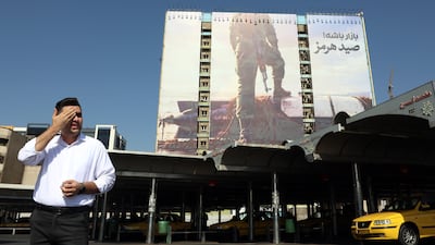 A billboard in Tehran depicts a member of the IRGC with his foot on a US unmanned underwater vehicle, which Iran claims to have seized in the Strait of Hormuz. EPA