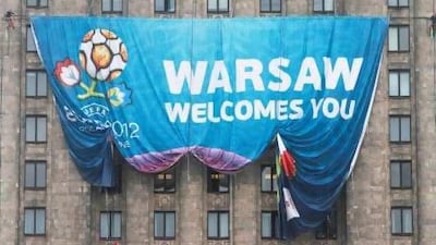 A giant Euro 2012 banner is spread on Warsaw's landmark, the Palace of Culture ahead of the tournament, which starts on Friday. Czarek Sokolowski / AP Photo