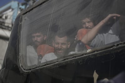 Palestinian prisoners released from Israeli jails arrive in Khan Younis in the southern Gaza Strip on Monday. Bloomberg