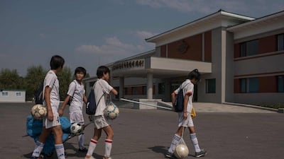 Students break for lunch following a training session at the Pyongyang International Football School. Ed Jones / AFP