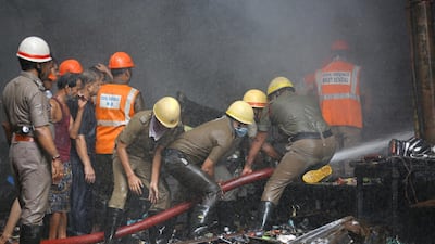 Firefighters use a cutter to remove debris. EPA