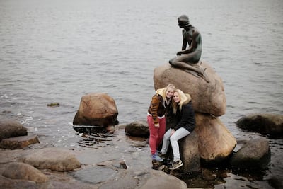 A statue inspired by Hans Christian Andersen's story 'The Little Mermaid' is visited by tourists in Copenhagen to this day. Christoph Bangert for The National