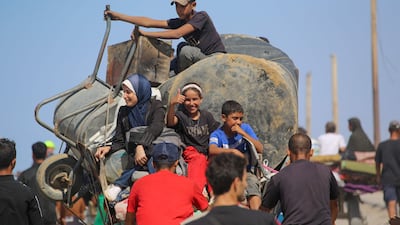 Palestinians make their way along Al Rashid road towards Gaza city. AFP