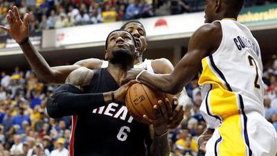 LeBron James, with the ball, scored 40 points for the Miami Heat in their win over the Indian Pacers.