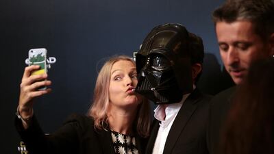 People walk the ‘black carpet’ ahead of the Star Wars: The Force Awakens Middle East premiere at Emirates Palace in Abu Dhabi. Christopher Pike / The National