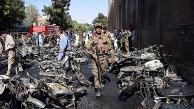 Afghan security personnel arrive at the site of a motorcycle bomb explosion in front of the Jami Mosque in Herat on June 6, 2017. AFP / HOSHANG HASHIMI