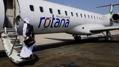 Thamer boards the plane.