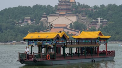 A ferry transports tourists visiting the Summer Palace in Beijing. AP Photo