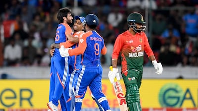 India's Ravi Bishnoi, left, celebrates with teammates after taking the wicket of Bangladesh's Litton Das, who scored 42, during the home side's 133-run victory in the third and final T20I at the Rajiv Gandhi International Stadium in Hyderabad on October 12, 2024. AFP