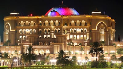 Abu Dhabi's Emirates Palace hotel is illuminated on Sunday with US flag's colours to mark the Fourth of July.