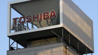 A Toshiba logo on the company headquarters in Tokyo. The company is expected to announce its huge writedown today. Shohei Miyano / Reuters