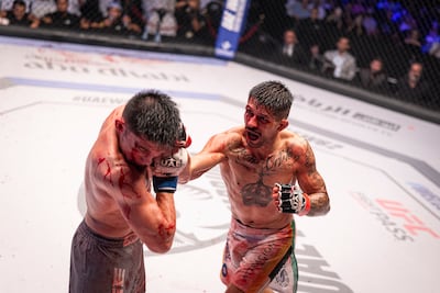 Felipe Douglas (white shorts) in action against Zhasulan Akimzhanov in the lightweight contest. Photo: UAE Warriors