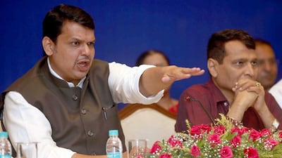 The Maharashtra chief minister Devendra Fadnavis, left, and the Union Railway minister Suresh Prabhu during the signing of the agreement on the Jaigarh Digni Rail project in Mumbai on June 28. Arijit Sen / Hindustan Times via Getty Images