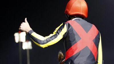 epa05231705 Ryan Moore on Real Steel from Japan celebrates after winning the Dubai Turf race during the Dubai World Cup 2016 at the Meydan race course in Gulf emirate of Dubai, United Arab Emirates, 26 March 2016. The Dubai World Cup is one of the richest events in the horse racing sporting calendar. EPA/ALI HAIDER