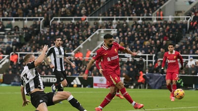 Liverpool's Mohamed Salah scores his side's second goal in a 3-3 draw against Newcastle at St James' Park. AP