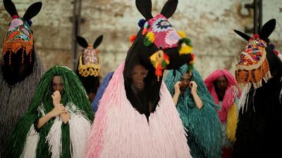 Dancers dressed as a horses listen to instruction from a choreographer during a press preview by American artist Nick Cave of his first major work shown in Australia, entitled HEARD.SYD in Sydney. Over several days the live art performance will feature 30 ‘horses’ dancing to live percussion beats in suits made from coloured raffia plant fibres. Jason Reed / Reuters