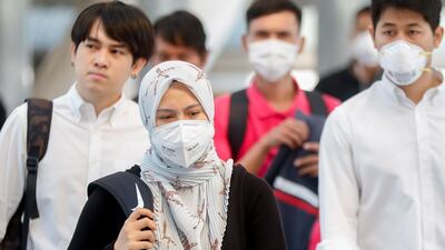 People wear face masks as heavy air pollution continues to affect Bangkok on January 30, 2019. EPA