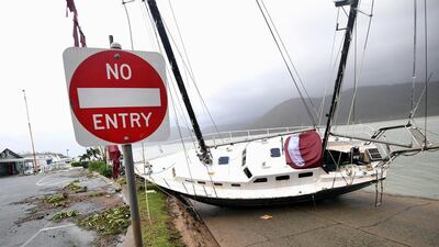 A boat smashed against the bank at Shute Harbour, Airlie Beach. Dan Peled/ AAP image via Reuters