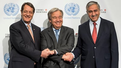 Greek Cypriot leader, Nicos Anastasiades, left, UN Secretary-General Antonio Guterres, centre, and Turkish Cypriot leader, Mustafa Akinci, right, pose for a group picture during a new round of the talks on Cyprus under the auspices of the United Nations, in Crans-Montana, Switzerland on June 30, 2017. Jean-Christophe Bott/Keystone via AP