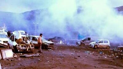 The scene after a car explosion in Reyhanli near the Turkish-Syrian border crossing point in Hatay, which killed at least 12 people and wounded dozens.