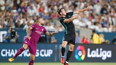 Real Madrid's Gareth Bale, right, and Manchester City's Nicolas Otamendi vie for the ball. Paul Buck / EPA