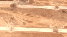 A satellite image shows craters on the runways of Abu Al Duhur airbase, near Aleppo. Reuters
