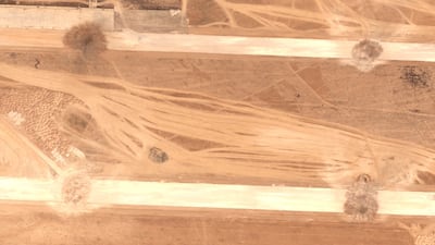 A satellite image shows craters on the runways of Abu Al Duhur airbase, near Aleppo. Reuters