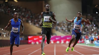 Jamaica's Usain Bolt, centre, crosses the finish line to win the men's 100m event at the IAAF Diamond League athletics meeting in Monaco on July 21. Valery Hache / AFP