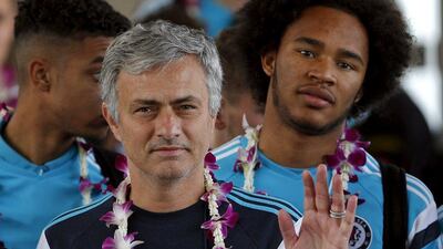 Jose Mourinho waves to fans after Chelsea arrived at Don Muang International Airport, ahead of Saturday's match against Thailand's All Stars. Chaiwat Subprasom / Reuters