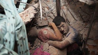 Embraced in death. The bodies of these garment factory workers were found after a building collapsed in Dhaka, Bangladesh. Taslima Akhter