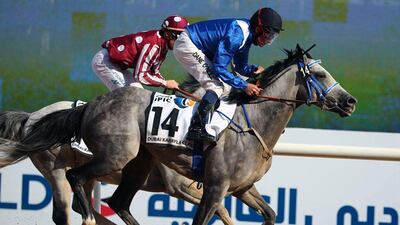 Irish jockey Dane O'Neill on his Af Mathmoon (R) leads before winning the Dubai Kahalya Classic race during the Dubai World Cup day horse racing event on March 26, 2016 at the Meydan racecourse in the United Arab Emirate of Dubai. Closing the UAE racing season, the Dubai World Cup day features nine races including the world’s richest horse race, the ten million US dollars Dubai World Cup. / AFP / MARWAN NAAMANI