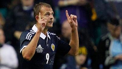 Scotland's Jordan Rhodes celebrates his goal against Australia at Easter Road