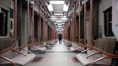 A man wearing a protective face mask attends a presentation of a new subway train for Moscow's Metro in Moscow, Russia. EPA