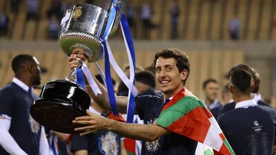 Real Sociedad's Mikel Oyarzabal celebrates winning the Copa del Rey with the trophy. Reuters