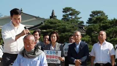 Deputy Speaker of the South Korean National Assembly Lee Ju-Young gets his head shaved. Reuters