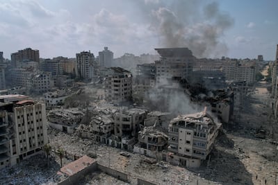 Buildings damaged by Israeli air strikes on Gaza City after an attack on Israeli soil by Hamas militants. AP