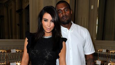 Kim Kardashian and Kanye West attend the Valentino show as part of Paris Fashion Week on July 4, 2012 in Paris, France. Getty Images