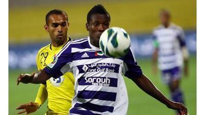 Al Ain's Asamoah Gyan, right, here in a game against Al Wasl, added to his league-leading goal total on Sunday night against Kalba in Al Ain's 3-1 victory.