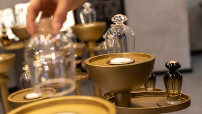 Lifting the bell jars at Al Bait Dimashqi Perfumes releases the scent of rich, fragrant oils.