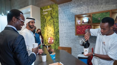 Sheikh Shakhbout enjoys a cup of coffee at Expo 2020 Dubai.