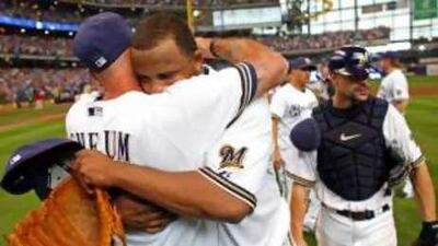 CC Sabathia hugs the Milwaukee Brewers interim manager Dale Sveum, back to camera, after their win.