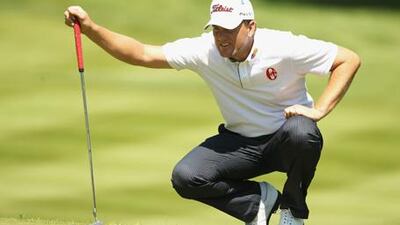 Robert Karlsson lines up a putt on the new 18th green for an eventual 12-footer during his third round after making a double bogey seven there the previous day.