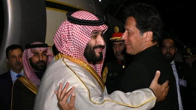 Pakistan's Prime Minister Imran Khan greets Saudi Arabia's Crown Prince Mohammed bin Salman on his arrival at Pakistan Air Force Nur Khan Base in Rawalpindi, Pakistan. Reuters