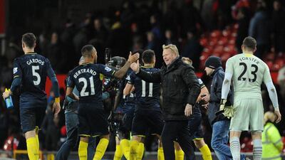Southampton's manager Ronald Koeman, right, shakes hands with defender Ryan Bertrand, left, after their win against Manchester United in the Premier League on Sunday. Oli Scarff / AFP / January 11, 2015