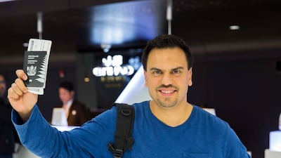 Complete with passport, Andrew departs Abu Dhabi International Airport for Shanghai, where his record-breaking journey began.