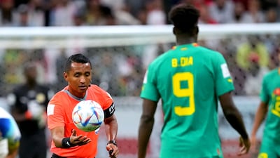 Referee Ivan Arcides Barton Cisneros changes the ball after it went flat. PA
