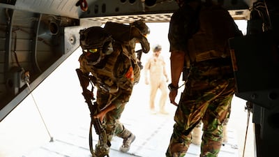 Iraqi Special Forces troops board a helicopter during the "Solid Will" military operation against ISIS militants in the desert of Anbar, Iraq.